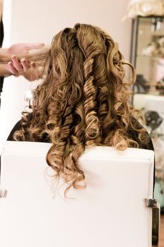 Bride being groomed and prepared for her wedding