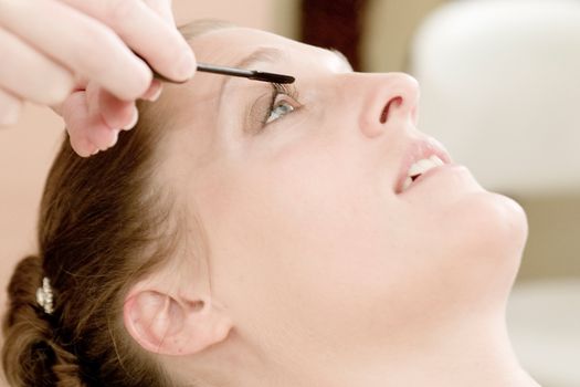 Bride being groomed and prepared for her wedding