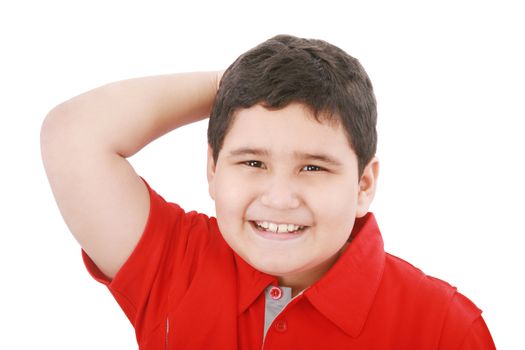 Young boy looking up with hand between the hair