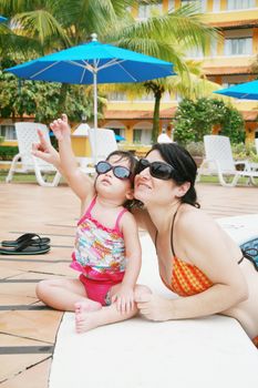 Mother and Daughter Playing in the Pool