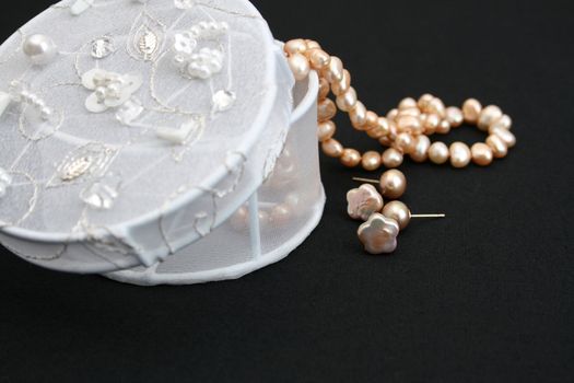 String of pearls and earrings with a jewelery box