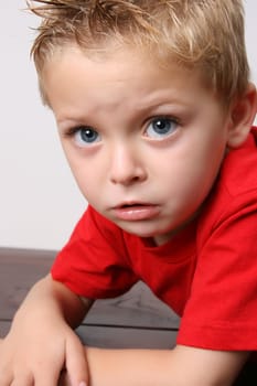 Beautiful blond toddler on a white background