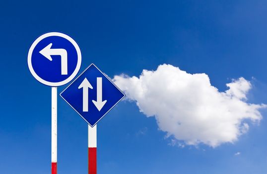 Curved Road Traffic Sign over blue sky,turn left