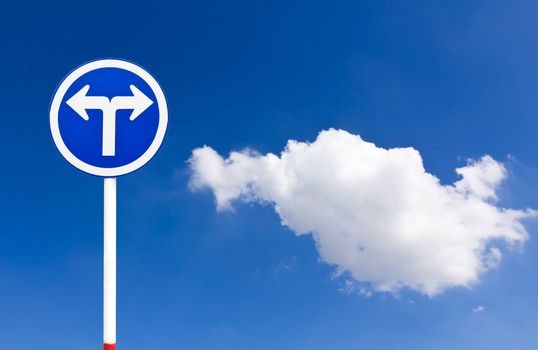 Curved Road Traffic Sign over blue sky,turn left