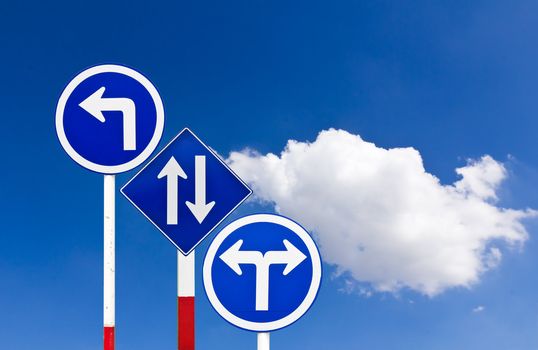 Curved Road Traffic Sign over blue sky,turn left