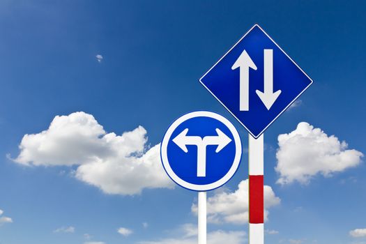 Curved Road Traffic Sign over blue sky