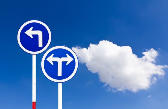 Curved Road Traffic Sign over blue sky,turn left