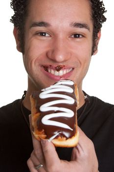 Smiling man eating chocolate donut