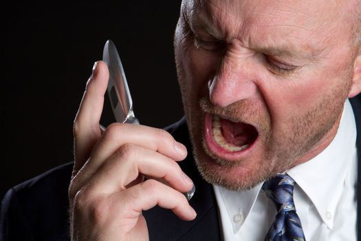 Angry man screaming on phone