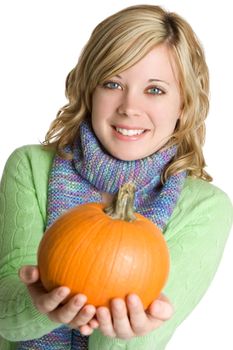 Beautiful smiling woman holding pumpkin