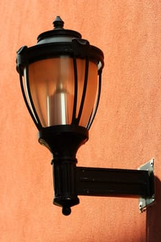A Street light on the side of a building