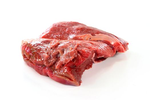 a piece of beef steak hip on a white background
