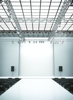 Empty fashion show stage with runway. 3D rendered image.