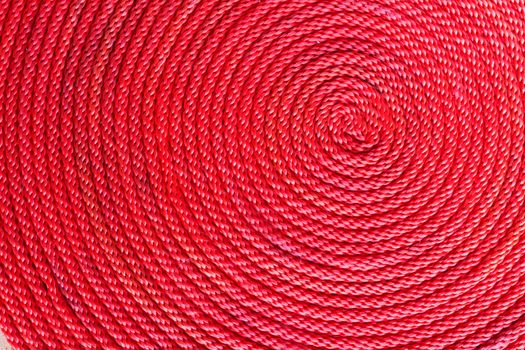 Spiral coil of braided red rope