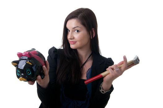 a young woman holding a piggy bank and a hammer looking unsure