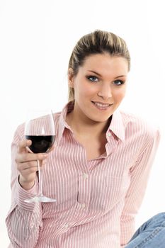 attractive young woman holding a glass of red wine 