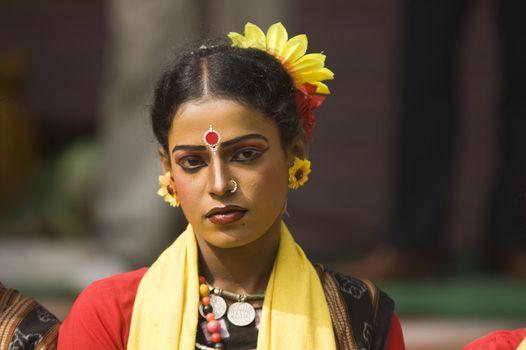 Indian dancer in traditional tribal outfit at the Sarujkund Craft Fair in Haryana near Delhi, India.