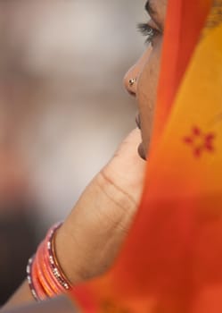 Indian lady in an orange sari in Wagah, Punjab, India