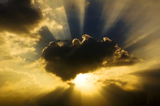 Image of sun shine through rain cloud