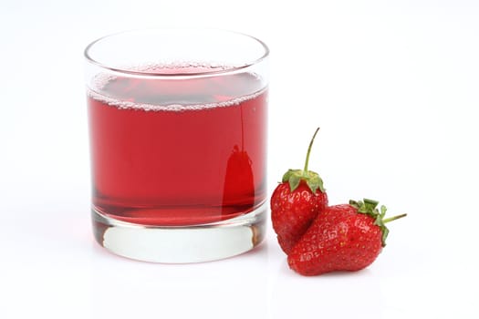 Glass with strawberry juice and berries. Isolated on a white background