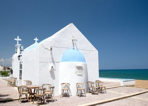 A Pretty Greek Orthodox Church on a headland in Crete Popular for outdoor weddings 