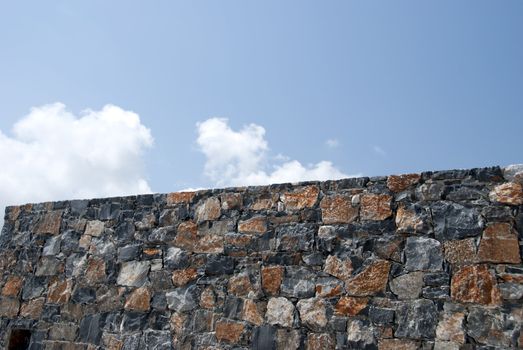 A Typical Dry Stone Wall from the Greek Island of  Crete under a blue summer sky