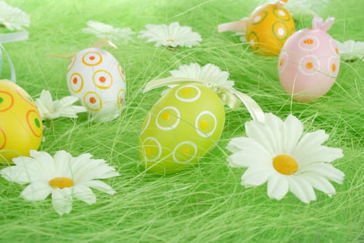 Painted Colorful Easter Eggs on green Grass