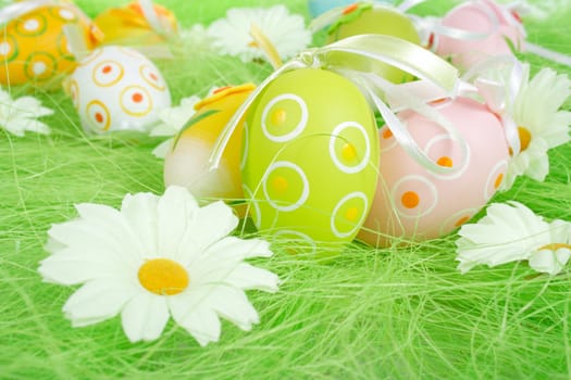 Painted Colorful Easter Eggs on green Grass