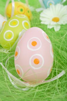 Painted Colorful Easter Eggs on green Grass