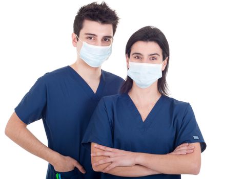 portrait of a team of doctors, man and woman wearing mask and uniform isolated on white background