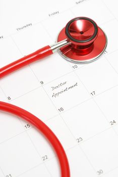 A scheduled doctors appointment is wrote on a calendar for a patient who is in need of their services.