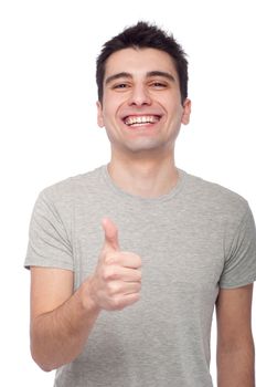 handsome young man with thumbs up on an isolated white background