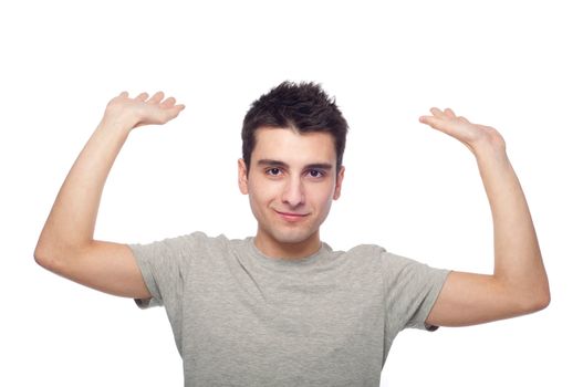 handsome young man trapped inside an invisible box (isolated on white background)