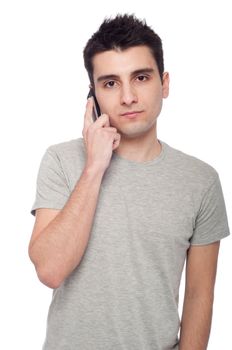 young casual man talking on the phone isolated on white background 