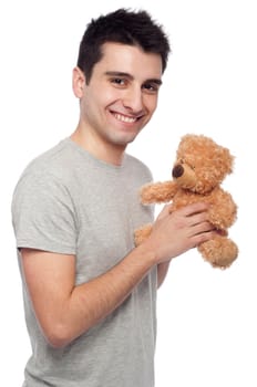 lovely portrait of a young man holding a teddy bear (isolated on white background)