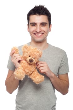 lovely portrait of a young man holding a teddy bear (isolated on white background)