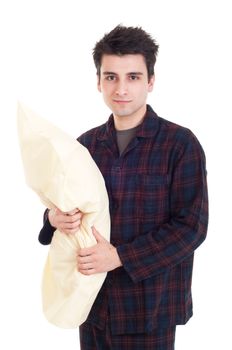 happy young man in pajamas holding pillow isolated on white background