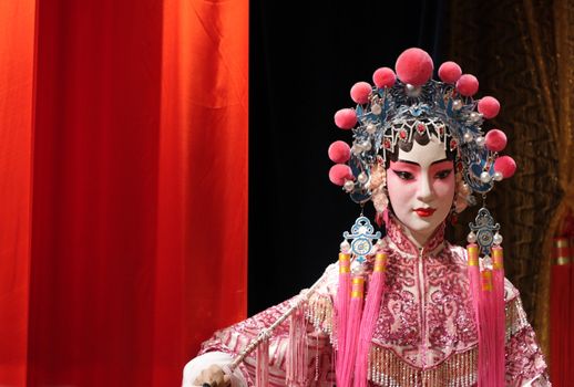 chinese opera dummy and red cloth as text space ,it is a toy,not real man 