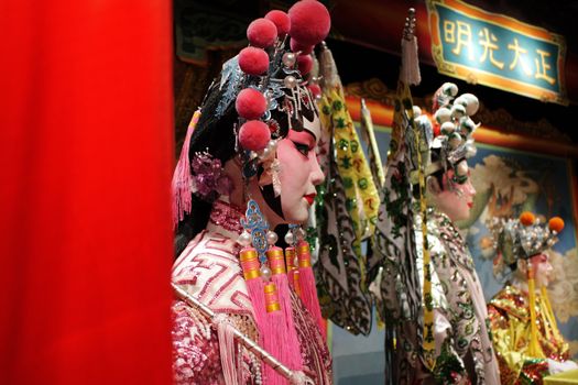 chinese opera dummy and red cloth as text space ,it is a toy,not real man 