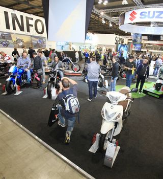 People visit motorcycels stands during EICMA 2011, International Motorcycle Exhibition in Milan, Italy