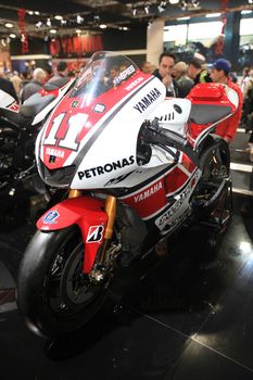 Looking at SBK Yamaha motorcycels during EICMA 2011, International Motorcycle Exhibition in Milan, Italy