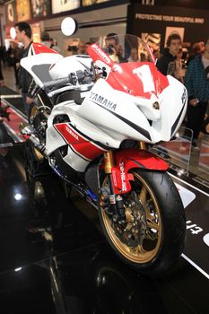 Looking at SBK Yamaha motorcycels during EICMA 2011, International Motorcycle Exhibition in Milan, Italy