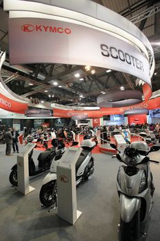 Visiting scooters and motorcycels stands during EICMA 2011, International Motorcycle Exhibition in Milan, Italy