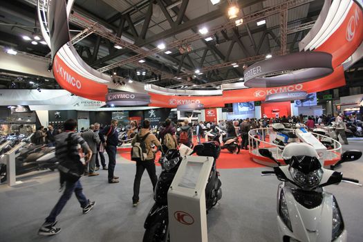 Visiting scooters and motorcycels stands during EICMA 2011, International Motorcycle Exhibition in Milan, Italy