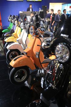 Visiting scooters and motorcycels stands during EICMA 2011, International Motorcycle Exhibition in Milan, Italy