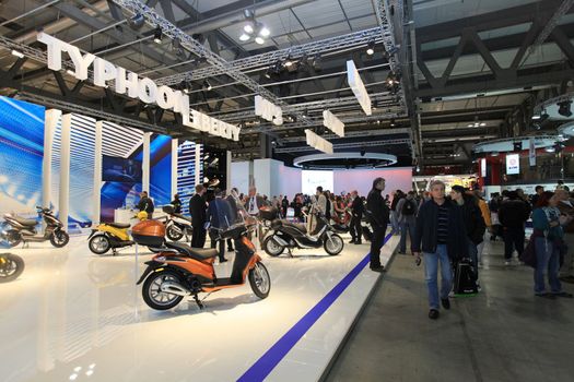Visiting scooters and motorcycels stands during EICMA 2011, International Motorcycle Exhibition in Milan, Italy