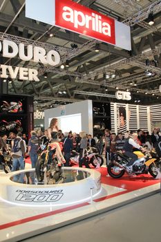 Visiting scooters and motorcycels stands during EICMA 2011, International Motorcycle Exhibition in Milan, Italy