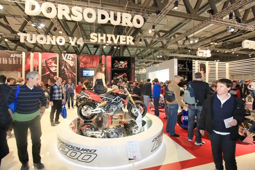 Visiting scooters and motorcycels stands during EICMA 2011, International Motorcycle Exhibition in Milan, Italy