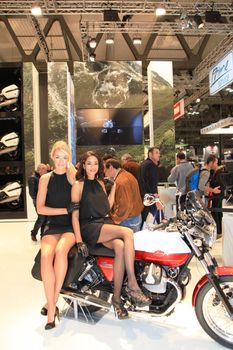 Visiting scooters and motorcycels stands during EICMA 2011, International Motorcycle Exhibition in Milan, Italy