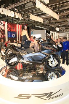 Visiting scooters and motorcycels stands during EICMA 2011, International Motorcycle Exhibition in Milan, Italy